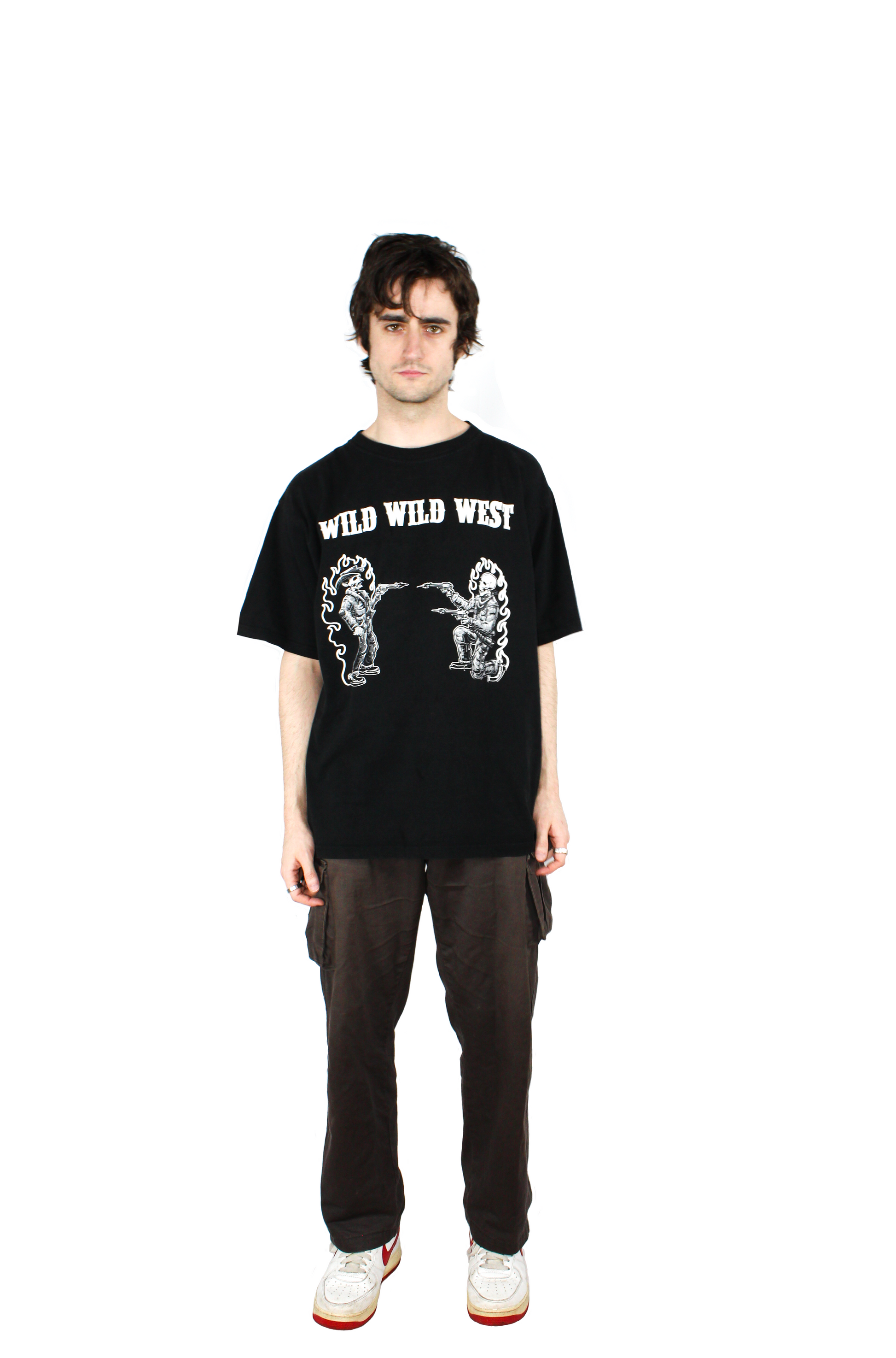 Model wearing heavyweight oversized baggy black tshirt made from 100% cotton with wild west themed design with an old school cowboy shootout